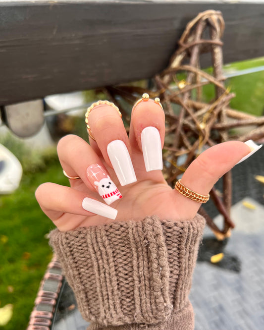 Mid square length white cheap press on nails with little cute polar bear on the ring finger.